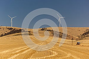 Landscape with wind generators distorted by hot air. South Australia.