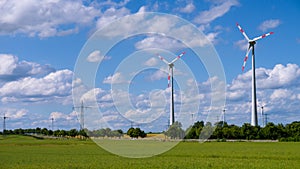 Landscape with wind generators and electrical tower