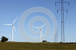 Landscape with wind turbines and high voltage power line