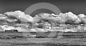 Landscape of a windmill and fields with white cloud in monochrome