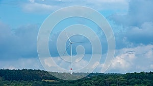 Landscape with windmills under the clody sky