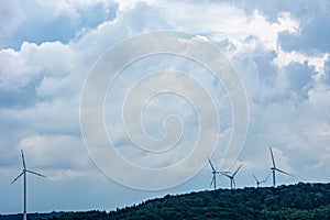 Landscape with windmills under the clody sky