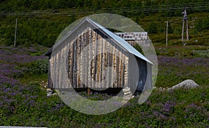 Landscape of wood house at the lake Ustevatnet Norway