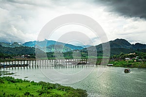 Landscape of Wooded bridge over the river (Mon Bridge) in Sangkhlaburi District, Kanchanaburi, Thailand