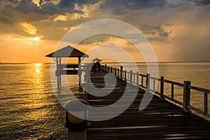 Landscape of Wooded bridge in the port between sunsets