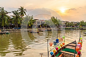 Landscape with wooden boats and Thu Bon River