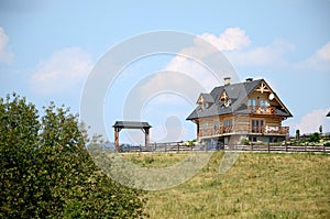 Landscape with wooden house