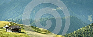 Landscape with wooden house in Dolomites Apl