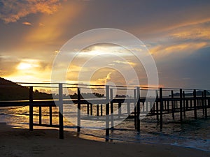 Landscape with wooden pier and beautiful sky at the sunrise