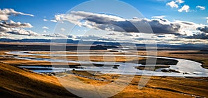 Landscape of the Yellow River in a field under the sunlight and a blue cloudy sky in Aba, China