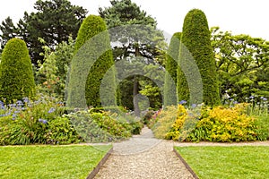 Landscaped english summer garden with a stone path