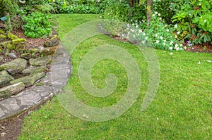 Landscaped garden scene with stone edging