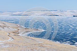 Landscape of winter island and frozen lake at lake Baikal in Siberia, Russia