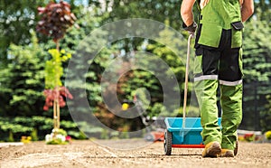 Landscaper Grass Seeding Using Manual Seed Distributor