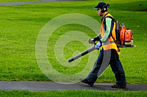 Landscaper operating petrol Leaf Blower