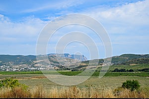 Landscapes of Crimean nature. Fields and hills visible from the car window from the road