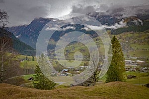 The landscapes and mountainous fields of Grindelwald in Switzerland photo