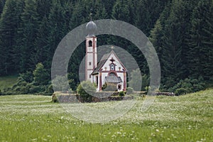 Landscapes with San Giovanni Church and small village in Val di Funes, Dolomite Alps, South Tyrol, Italy, Europe