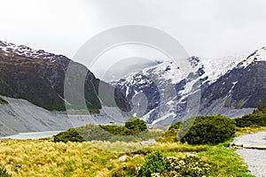 Landscapes in the Southern Alps. Lake surrounded by snow-capped mountains, New Zealand