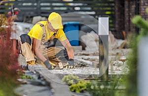 Landscaping Worker Building Backyard Garden Bricks Path