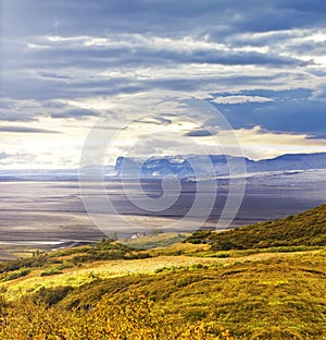 Landscpae of the black sand plains of Myrdalssandur with the glacier MyrdalsjÃ¶kull