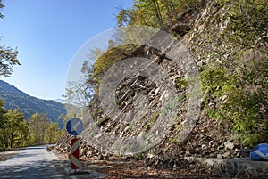 A landslide blocking part of a mountain road