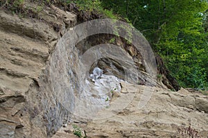 The landslide eroded the river bank