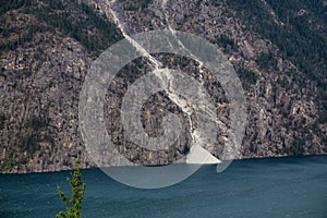 Landslide off a rocky mountain into Anderson Lake