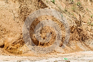 Landslide zone on Black Sea coast. Rock of sea rock shell. Zone of natural disasters during rainy season. Large masses of earth