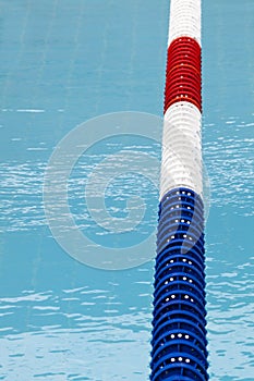 Lane divider, pool marker lines. Blue clean water