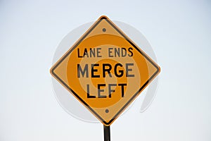 Lane ends merge left sign