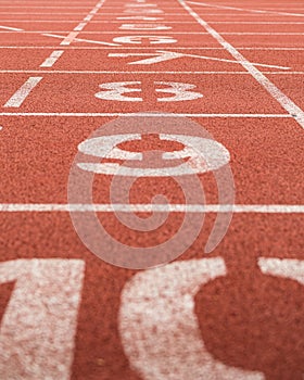 Lane numbers on red running track