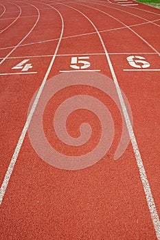Lanes of a red race track with numbers.