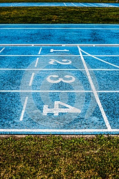 Lanes  on the track field, 1, 2, 3, 4, one, two three four number
