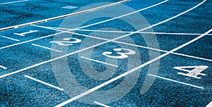 Lanes  on the track field, 1, 2, 3, 4, one, two three four number