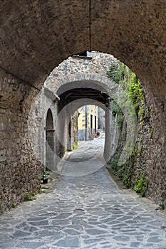 Laneway under stone arches photo