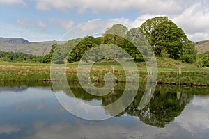 Langdale Pikes reflected in River Brathay