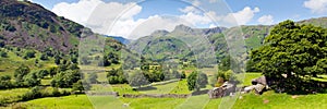 Langdale Valley Lake District Cumbria with mountains and blue sky panorama