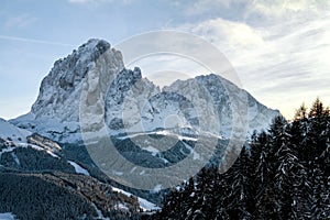 Langkofel or Sassolungo located in Val Gardena. Winter Landscape of the famous Lang kofel, Sasso lungo in the Dolomites