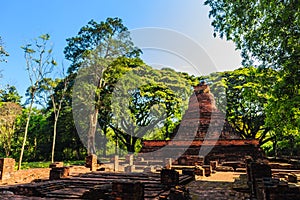 Lanka style ruins pagoda of Wat Mahathat temple in Muang Kao Historical Park, the ancient city of Phichit, Thailand. This tourist