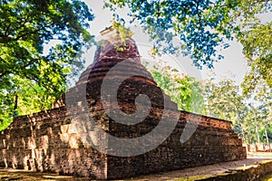 Lanka style ruins pagoda of Wat Mahathat temple in Muang Kao Historical Park, the ancient city of Phichit, Thailand. This tourist