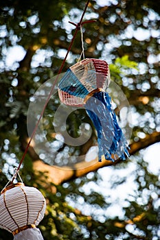 Lanna traditional paper lamp hanging on the tree