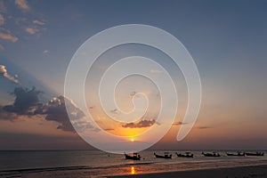 Lanscape of longtail boat in evening time with sunray beam