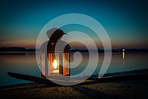 Lantern on the beach at the lake