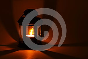 Lantern with burning candle