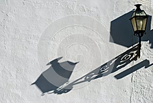 Lantern casting shadow on wall