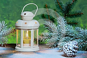 Lantern and Christma tree in the snow
