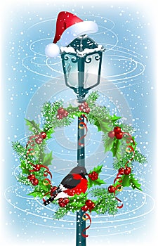 Lantern with Christmas wreath and bullfinch