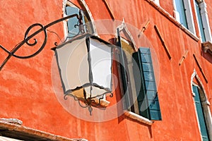 Lantern on the facade of old italian house