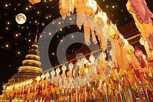 Lantern Festival in Lamphun people hang colorful light lanterns at Wat Phra That Hariphunchai Temple full moon